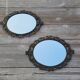 2 antique oval mirrors in heavy metal