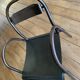 Industrial chair with rounded armrest spout