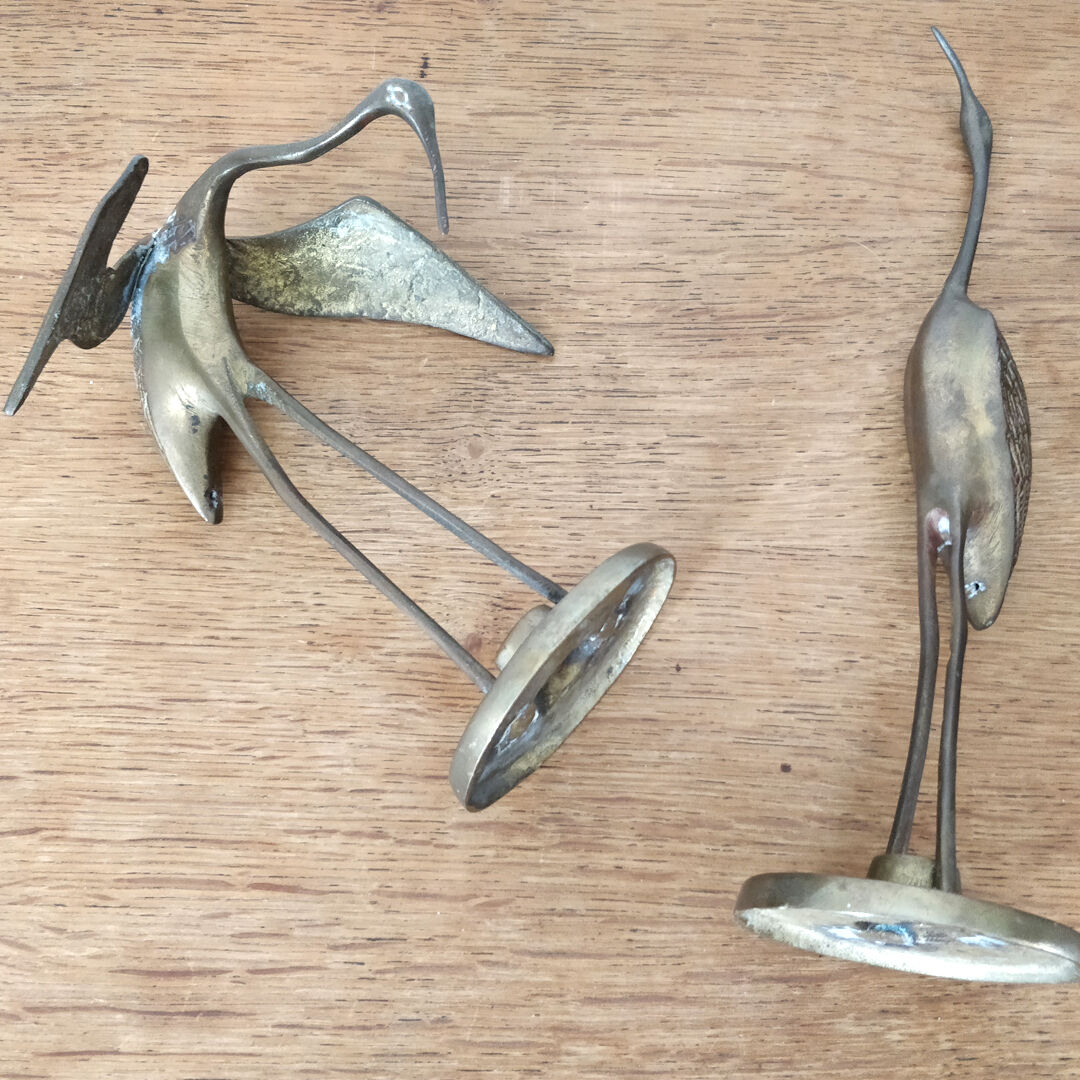 Couple herons in vintage brass