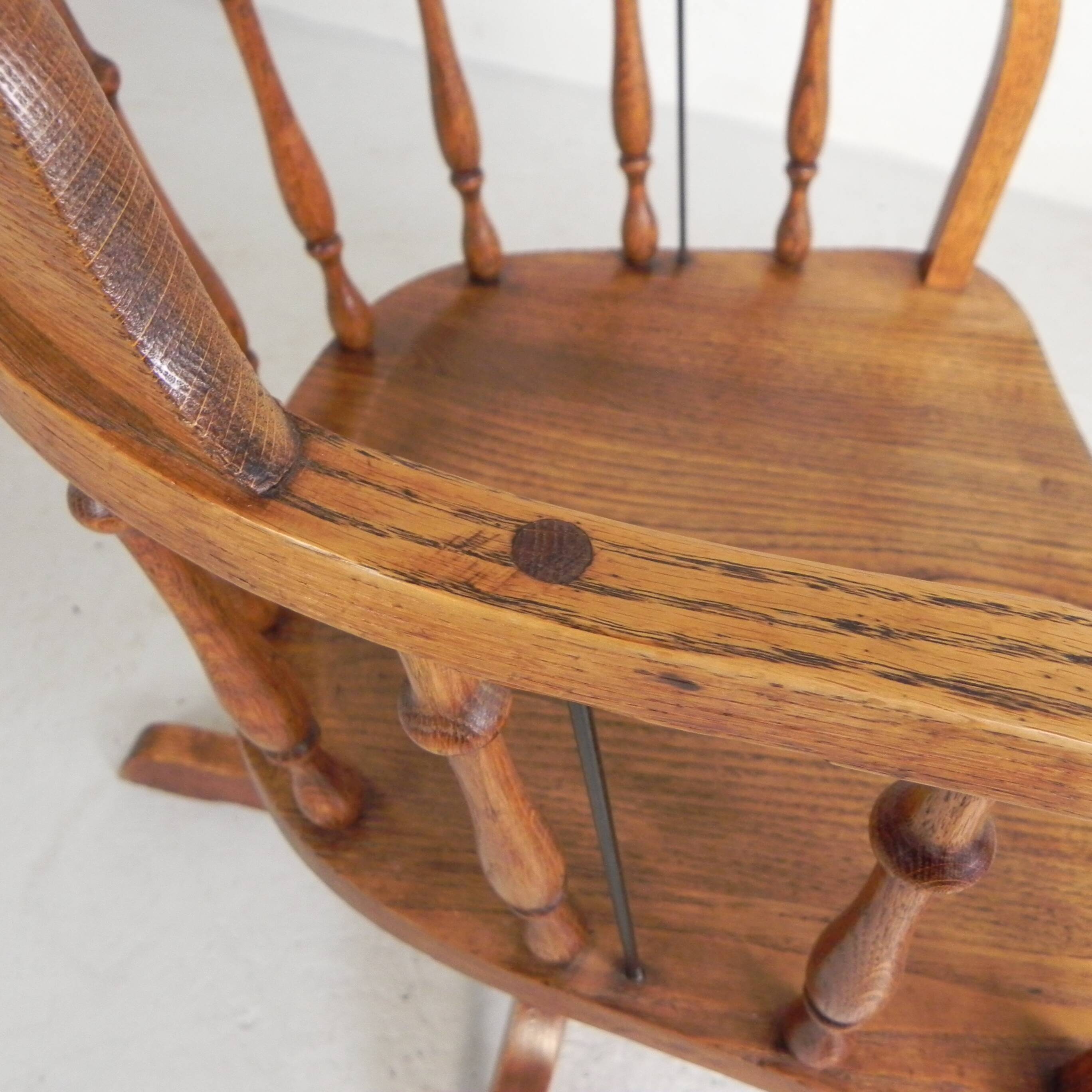 Oak office chair with a spring system and height adjustable, 1930s.