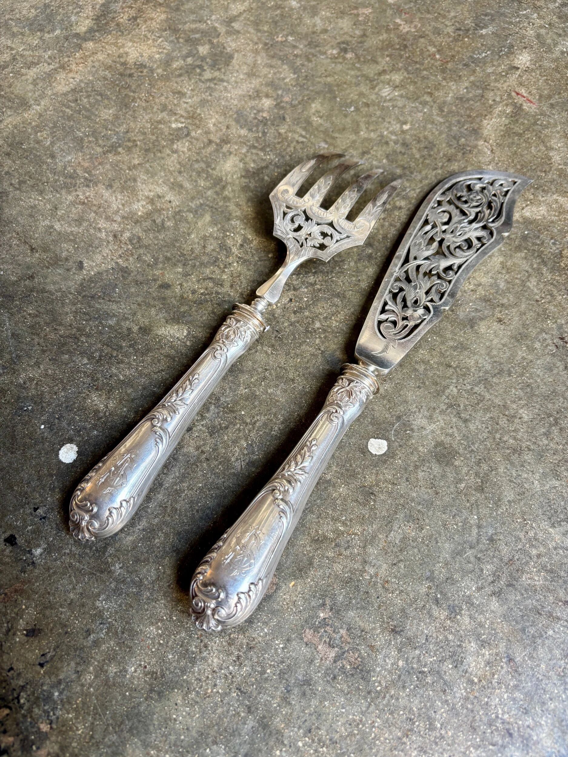 2 silver openwork service cutlery sets engraved with "AS"