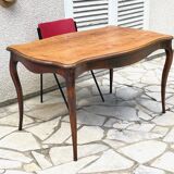 Solid wood table with curved legs