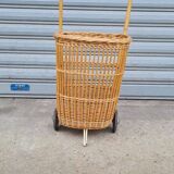 Vintage wicker log basket on vintage wheels