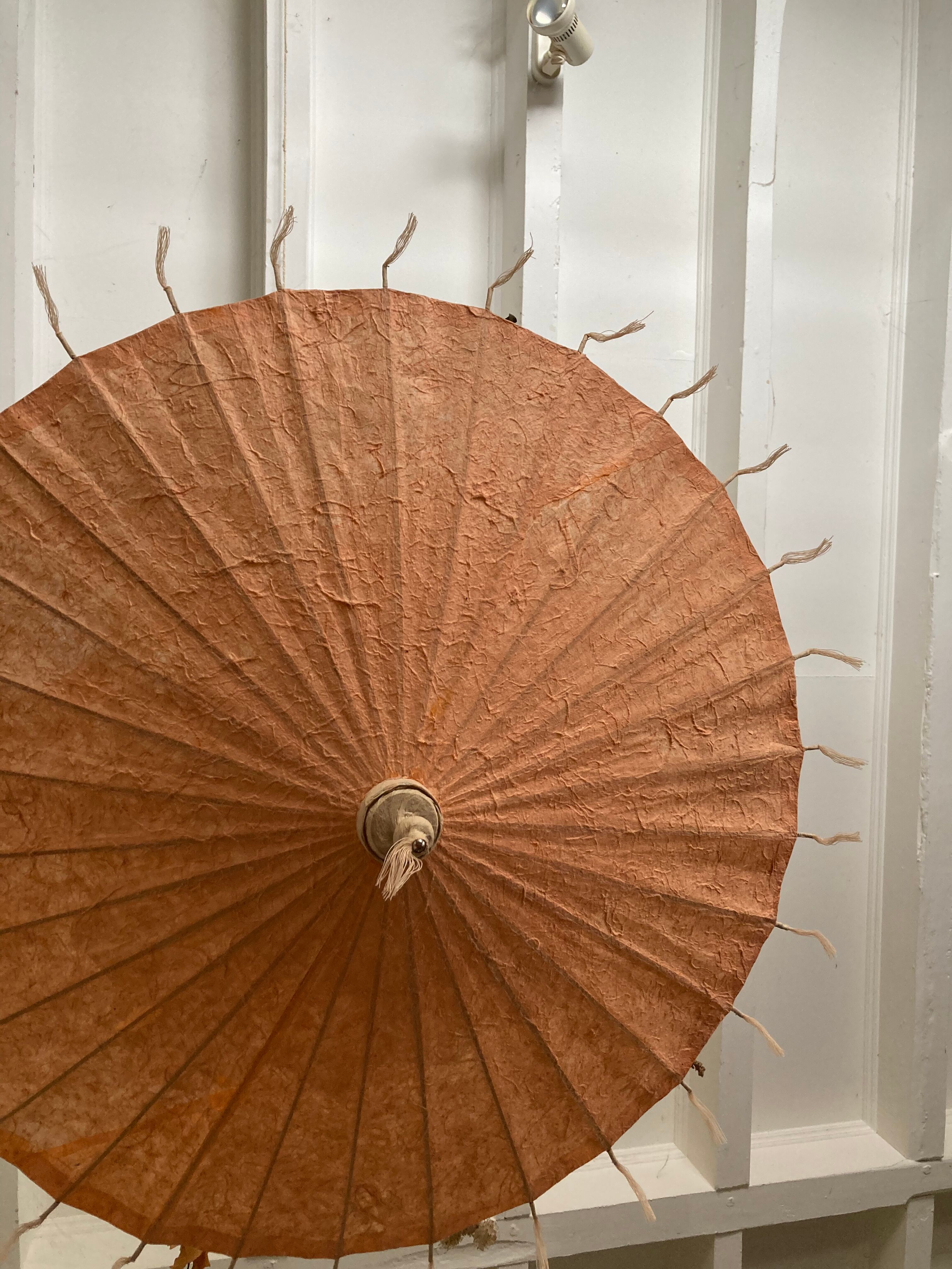 Powder pink paper umbrella and wooden handle