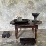 Coffee table, round antique Indonesian teak table with straight legs.