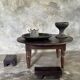 Coffee table, round antique Indonesian teak table with straight legs.