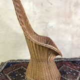 High-backed chair or shepherdess in vintage wicker