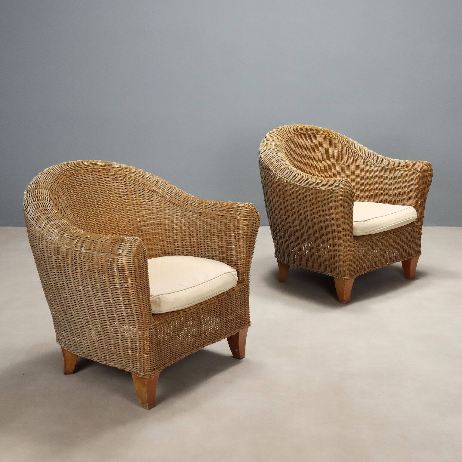 Two wicker armchairs