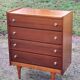 Vintage golden oak chest of drawers with 4 spindle feet from the 1950s