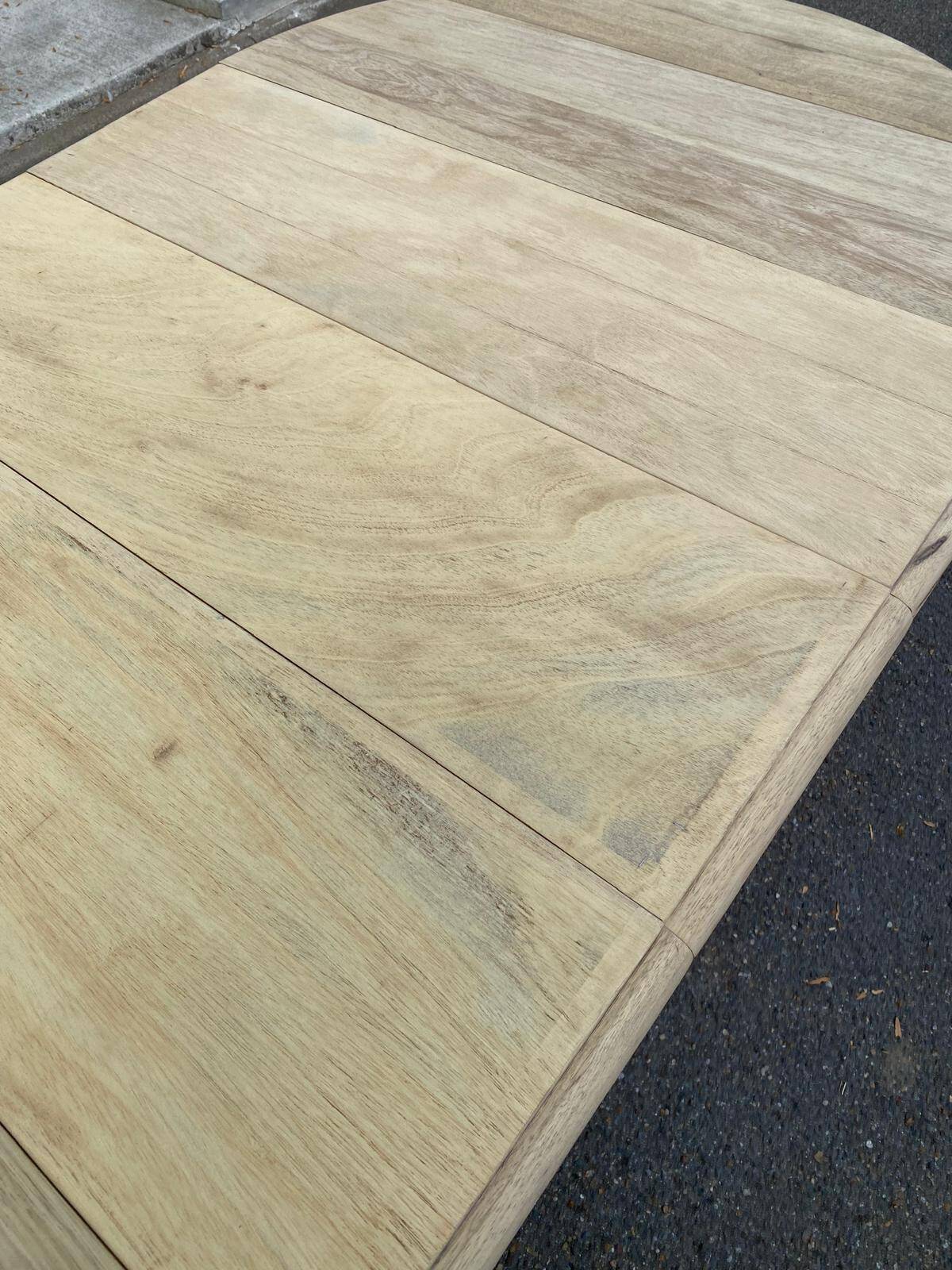 Round extendable dining table with flaps, stripped in raw oak, with 3 extensions.