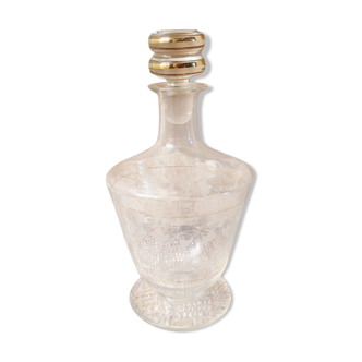Glass liquor carafe. Stylized floral decorations and gold edging