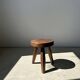 Low flat tripod stool in upcycled teak - Small tripod stool in solid brown wood with a circular seat.
