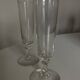 Pair of crystal champagne flutes with a button foot, 1960.