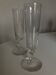 Pair of crystal champagne flutes with a button foot, 1960.