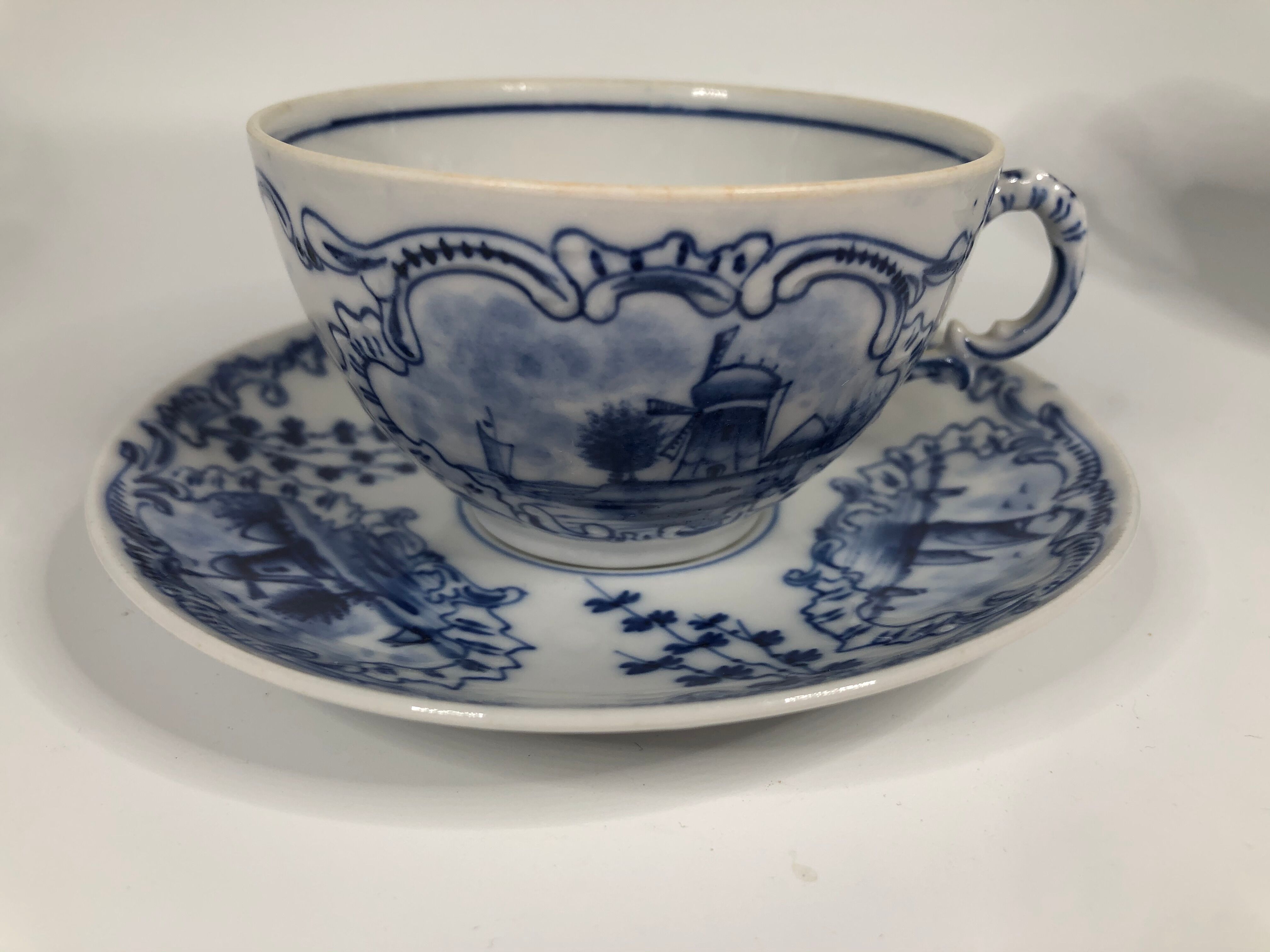 4 old cups and under Rauenstein Delft cups