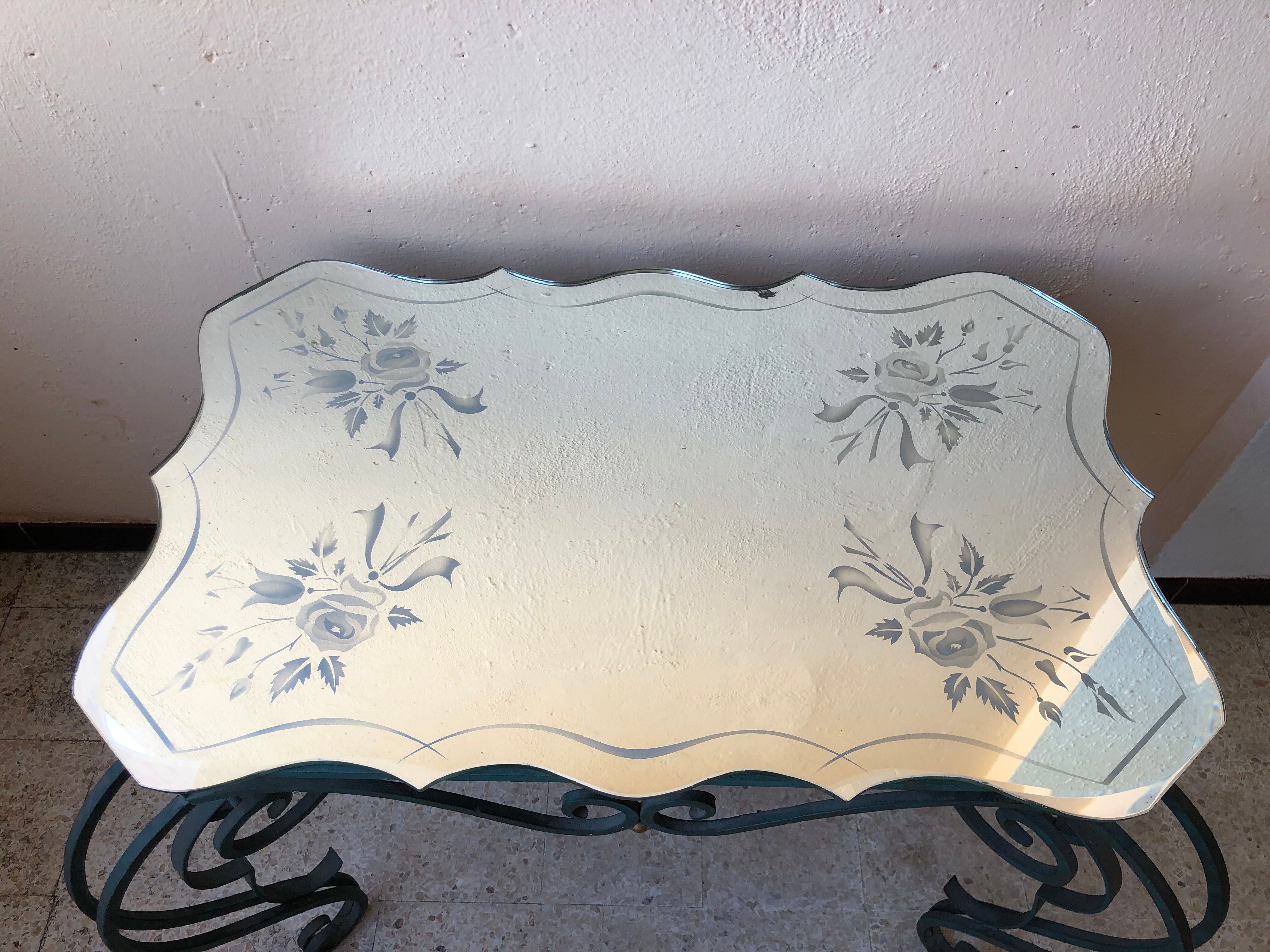 Wrought iron and engraved mirror