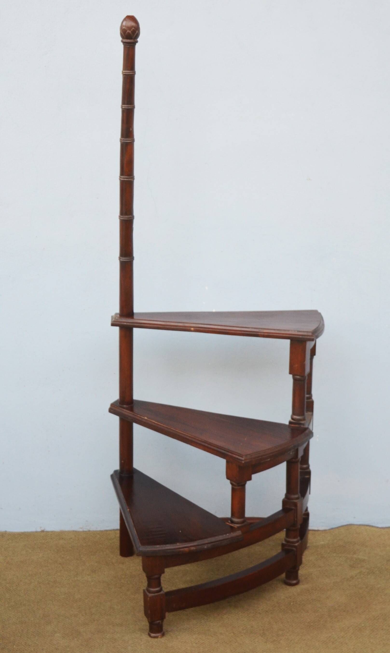Spiral staircase for library made of mahogany wood