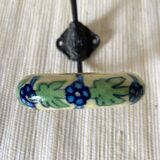 Metal and flowered ceramic coat hooks