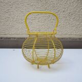 Old yellow painted metal egg basket