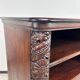 Art Nouveau cabinet with a shelf featuring distinctive floral sculptures.