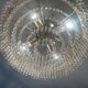 Cascading chandelier with crystal and silvered bronze pendants