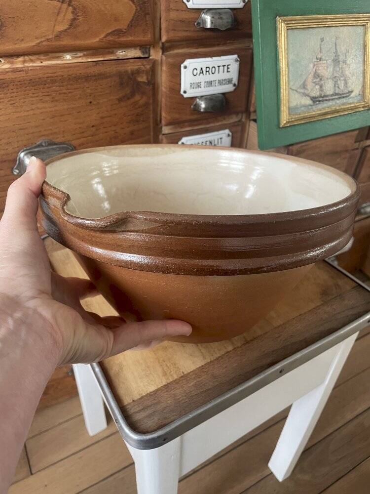 Antique spouted jug in terracotta