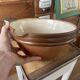 Antique spouted jug in terracotta