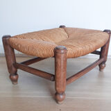 Low wooden stool and straw