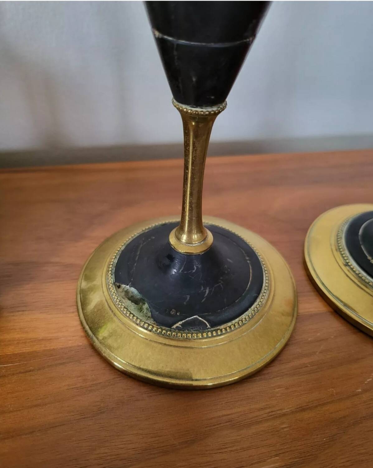 Pair of brass and black hard stone candlesticks