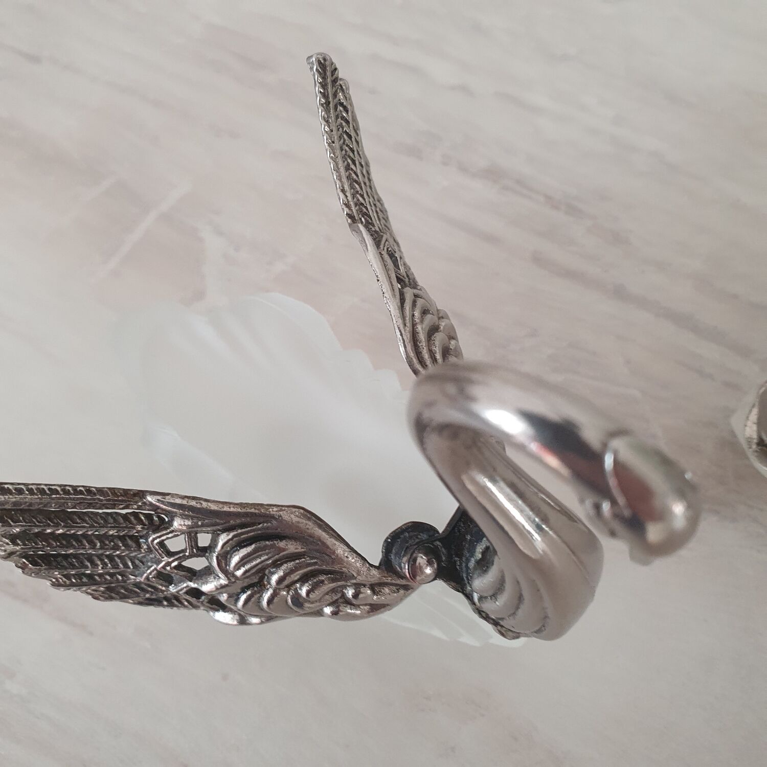 Two frosted glass swan salt cellars with silver plating.