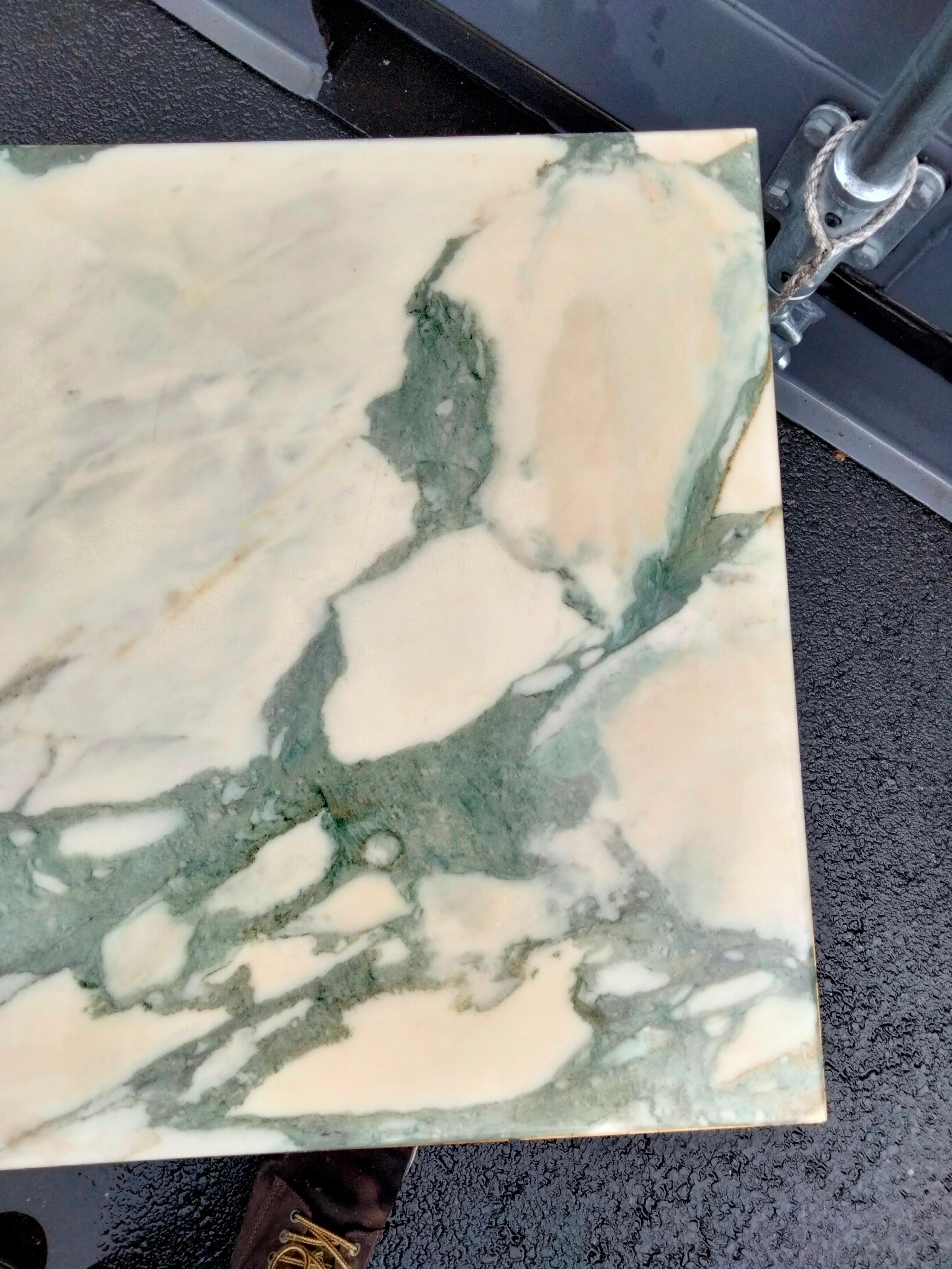 Old vintage gilded side table with marble top