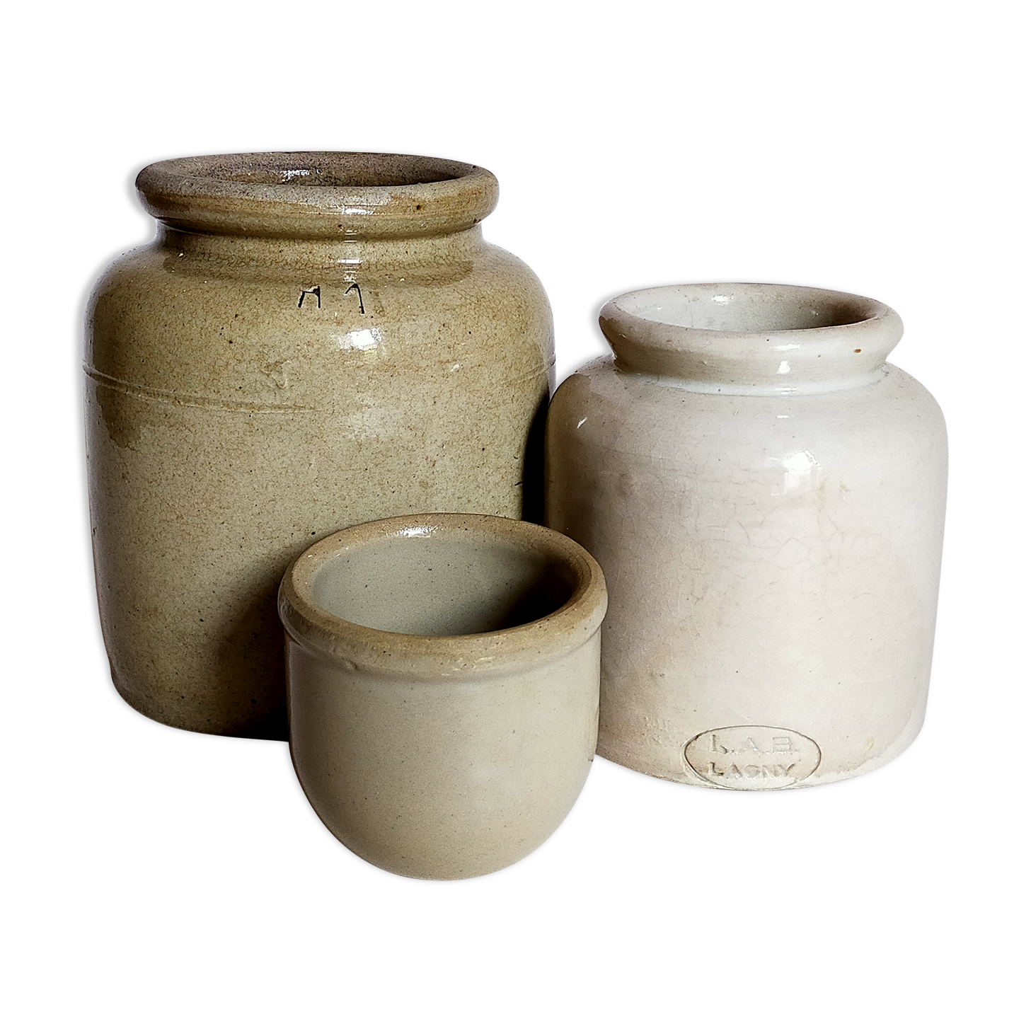 Set of three pots with old condiments in glazed earth