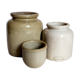Set of three pots with old condiments in glazed earth