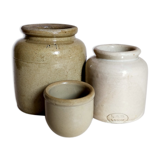 Set of three pots with old condiments in glazed earth