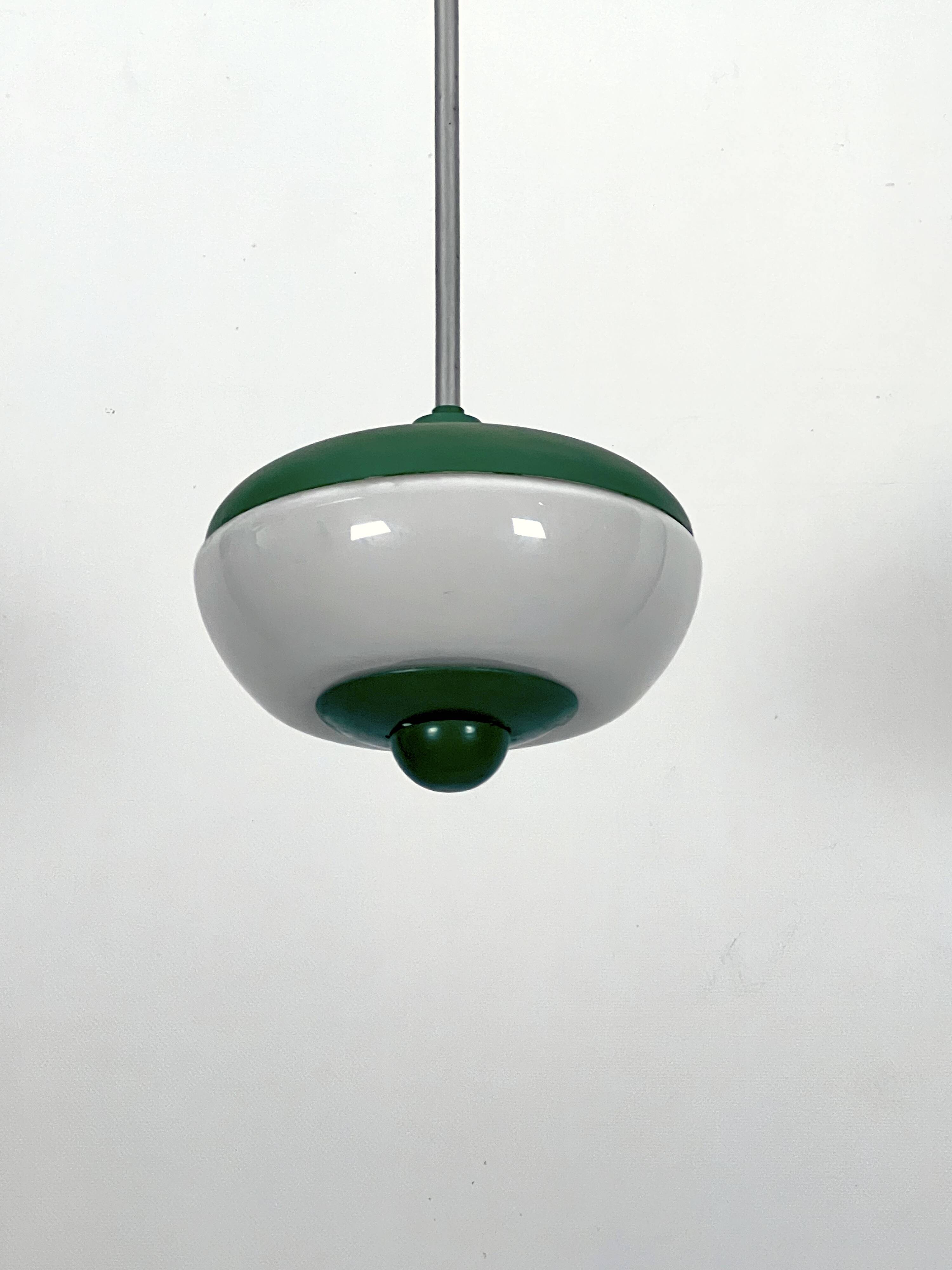 Mid-Century green lacquer and milk glass pendant. Italy 1950s