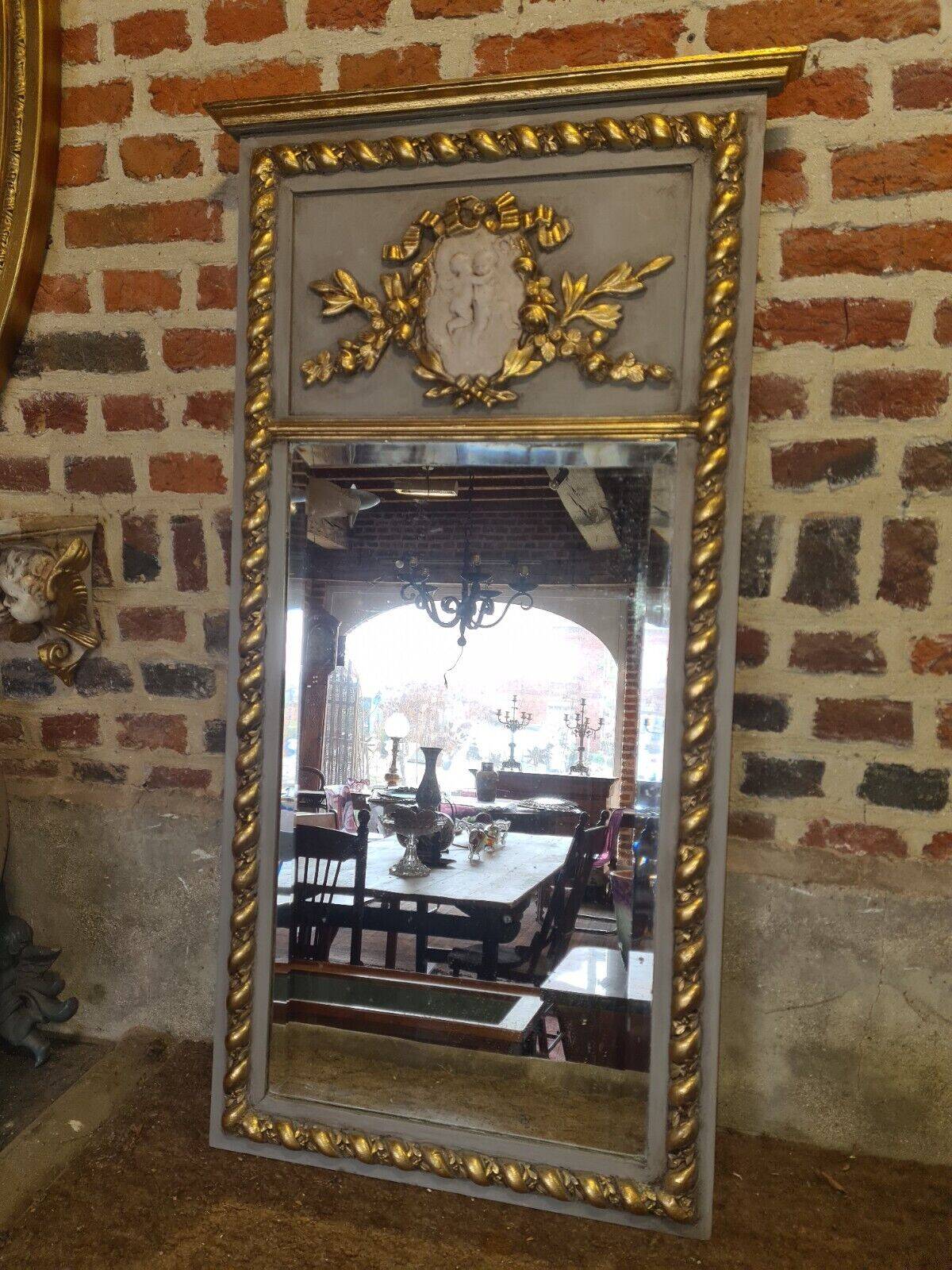 gray and gold patinated trumeau mirror