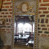 gray and gold patinated trumeau mirror