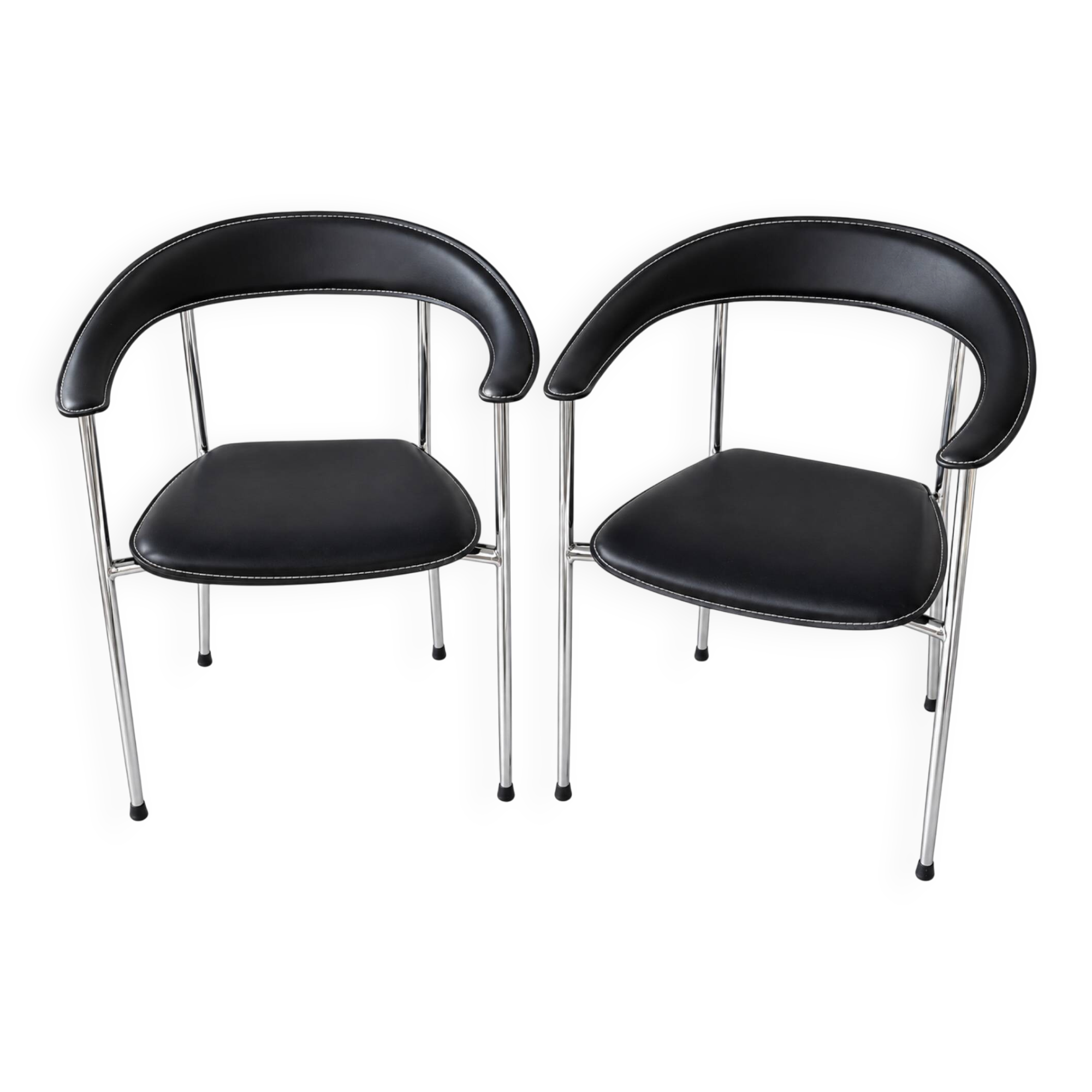 Set of two metal chairs with a brushed finish and black leather.