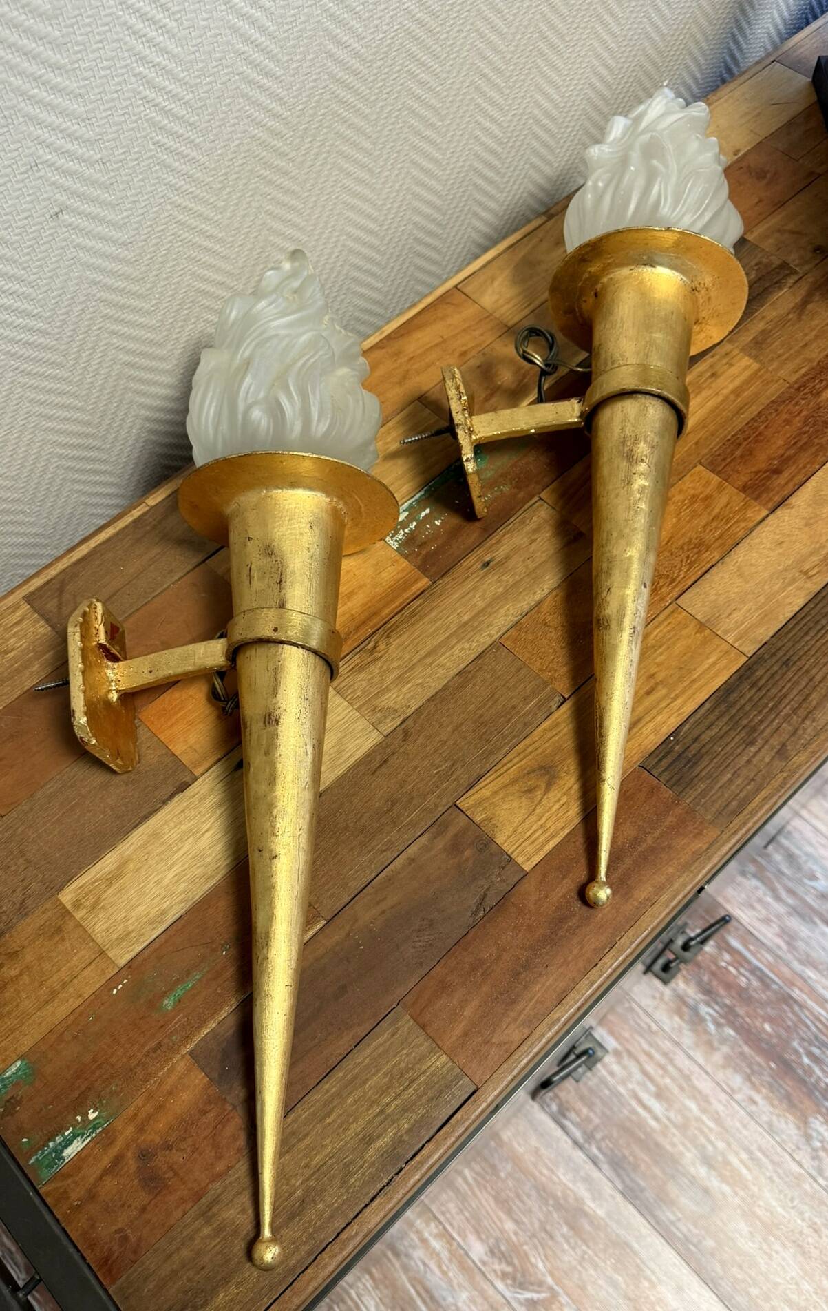 Pair of large medieval-style torchiere lamps in gilded metal