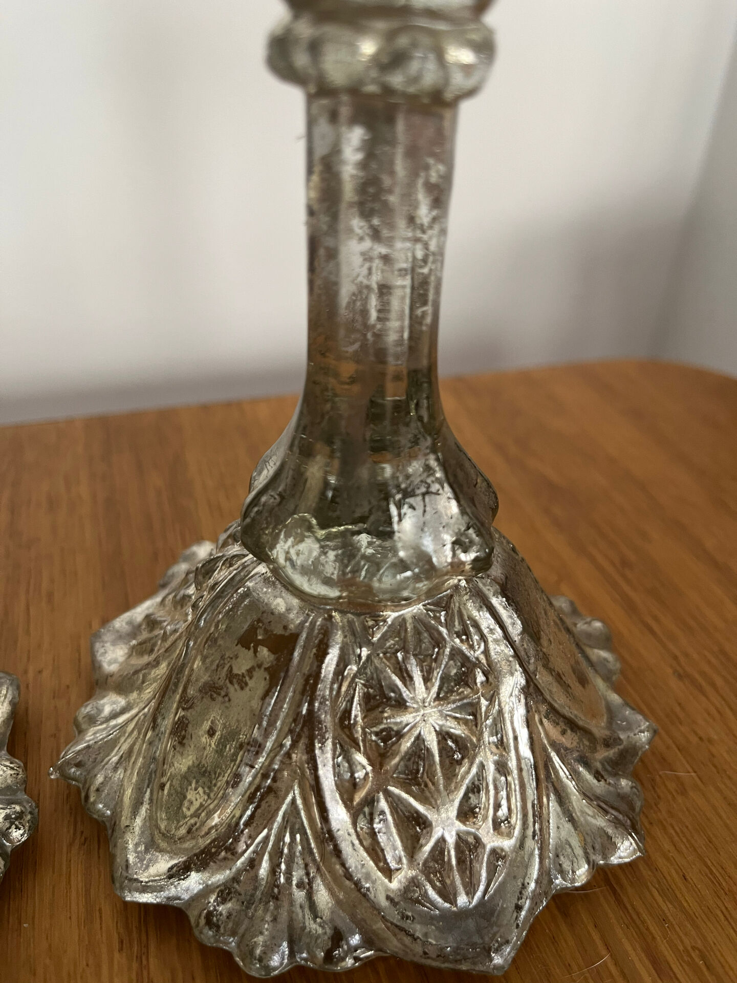 Pair of pressed glass candlesticks with silver plating.