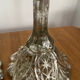 Pair of pressed glass candlesticks with silver plating.