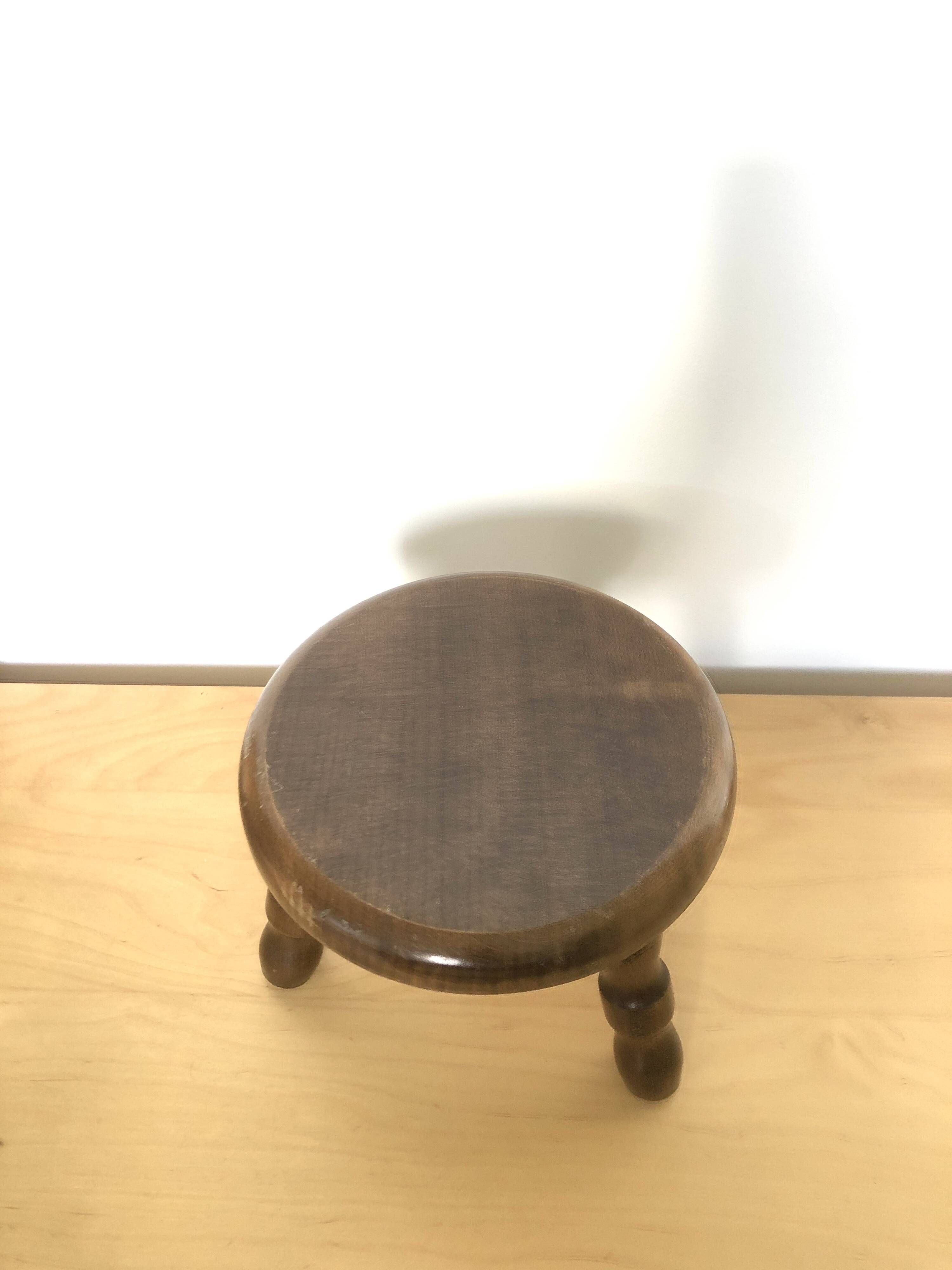 Low tripod stool in solid wood