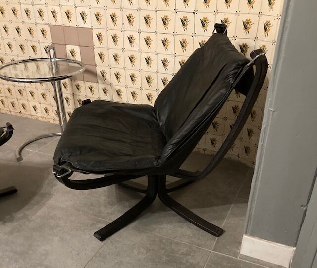 Leather Falcon armchair and footrest