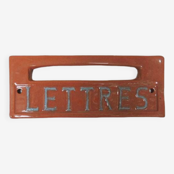 Old letters plaque in enameled terracotta