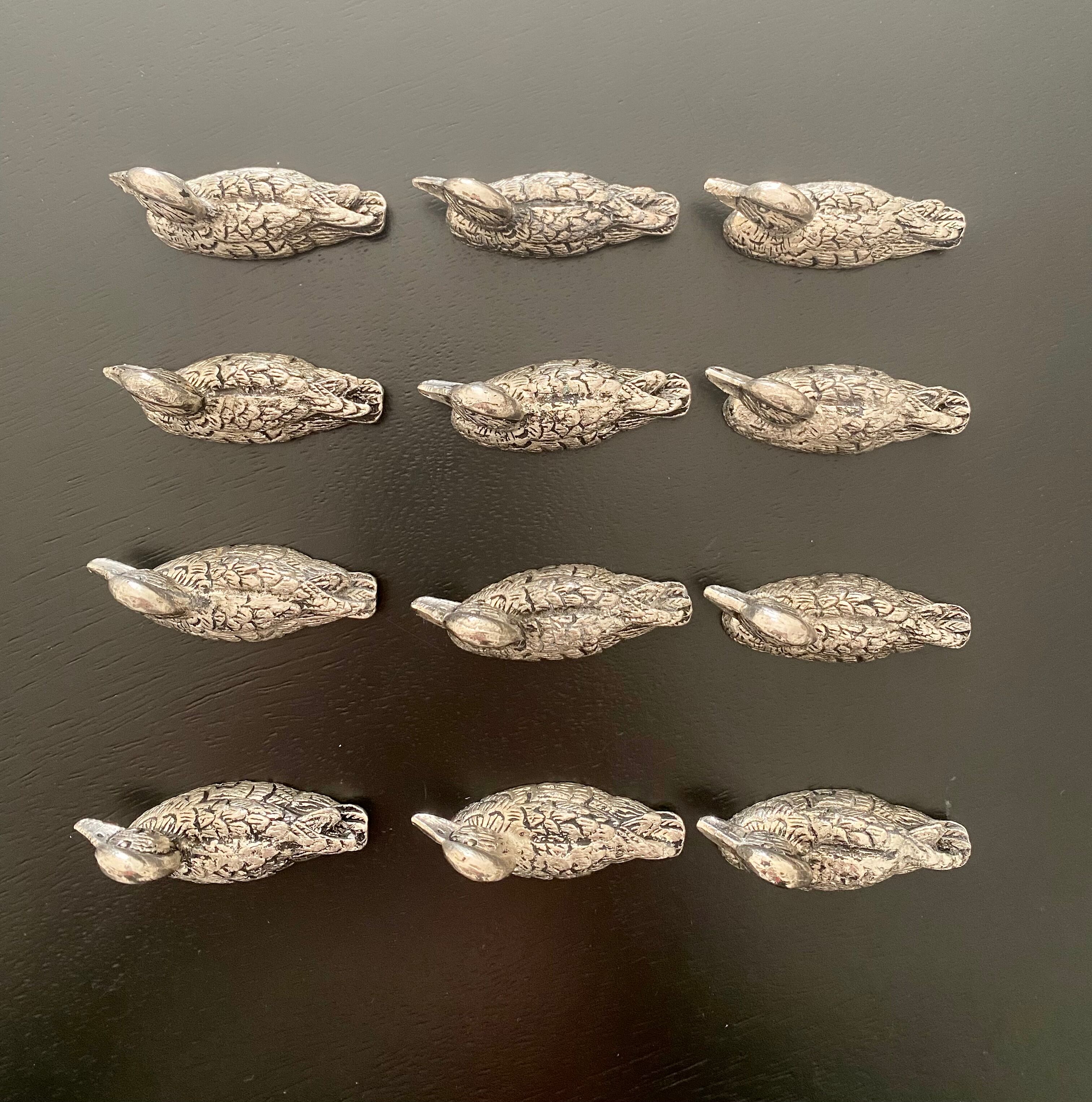 12 metal duck-shaped knife holders