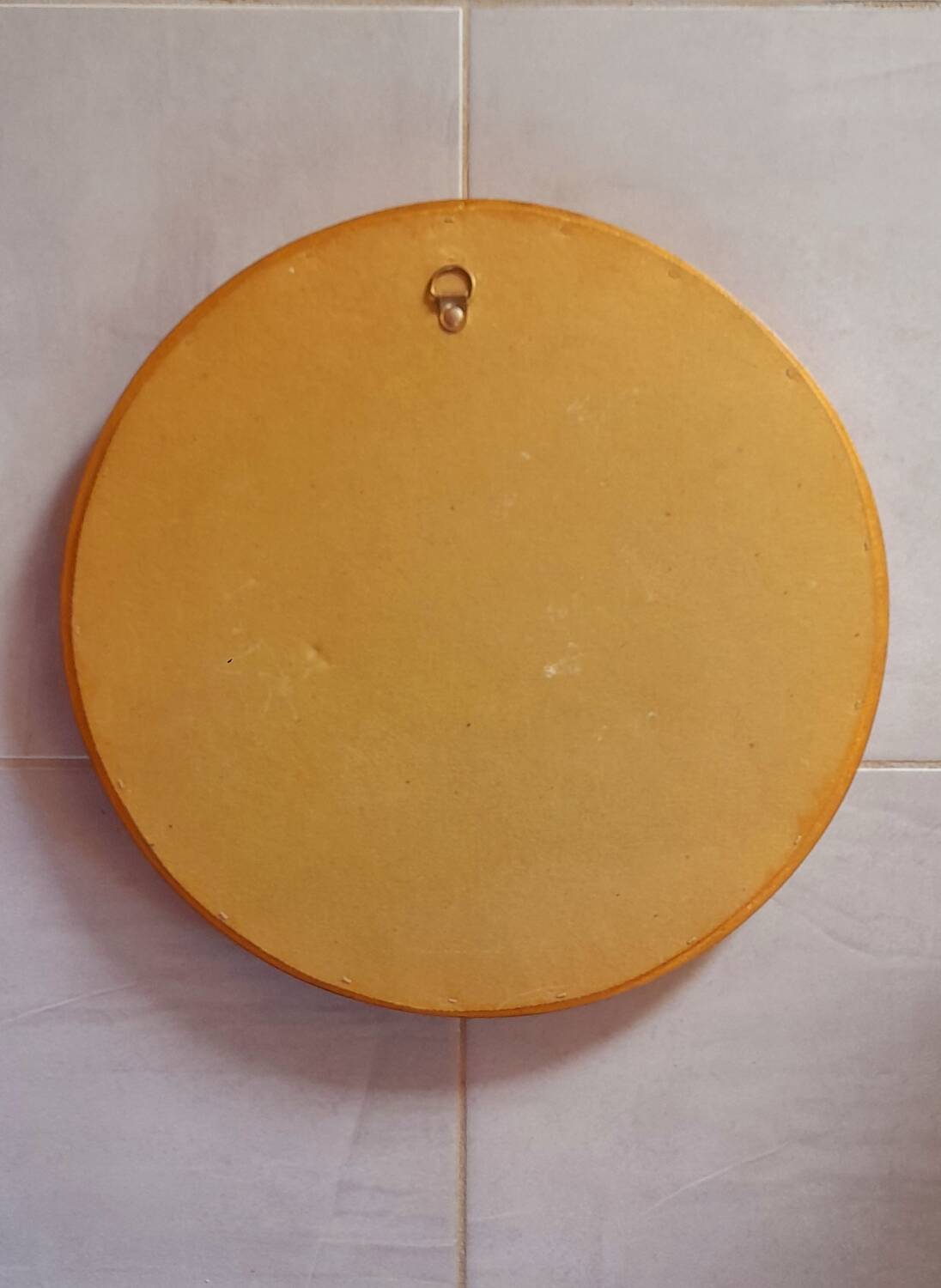 Round golden mirror, 1970.