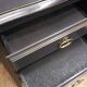 Cherry wood chest of drawers with 5 drawers in aged black.