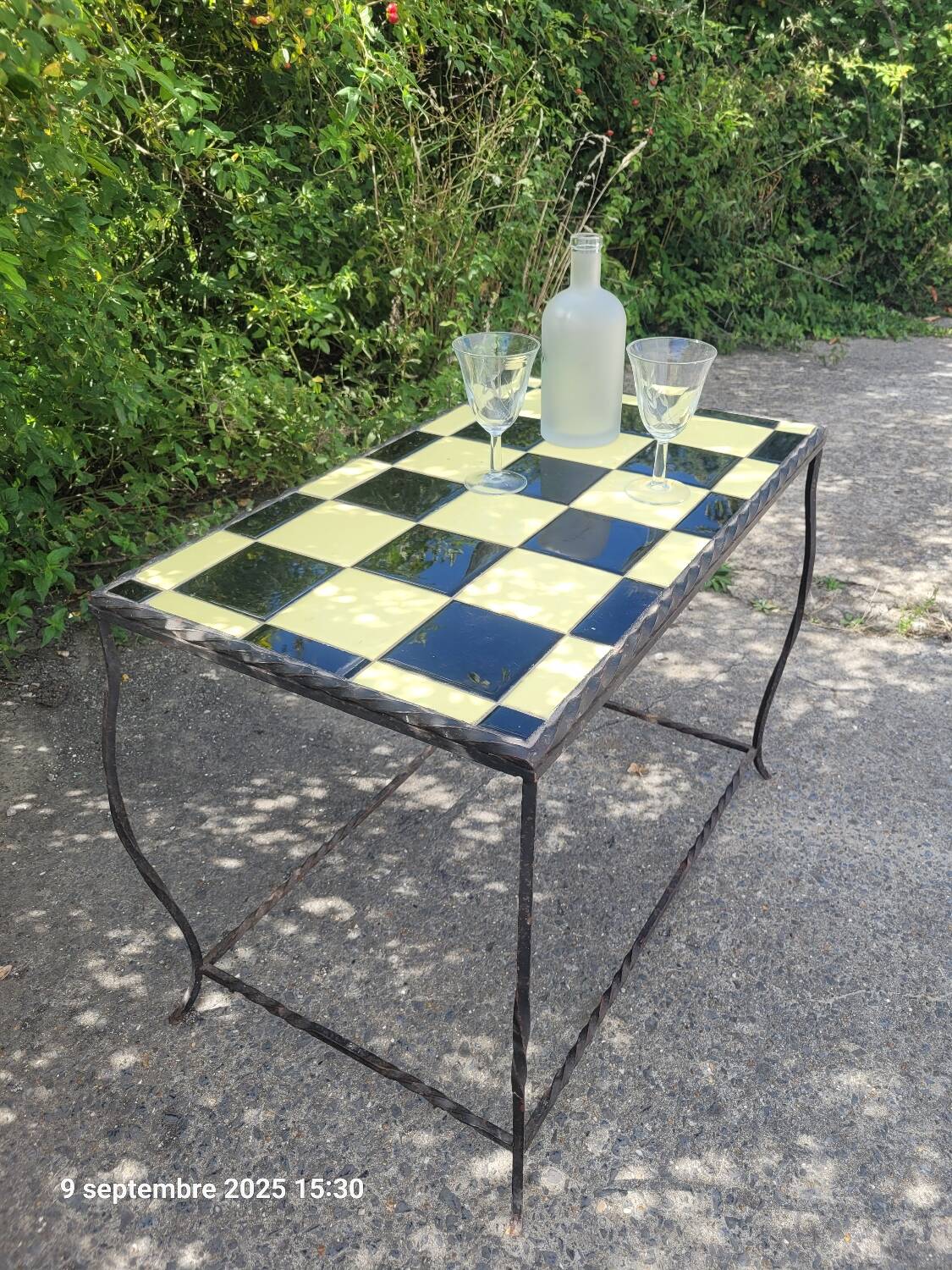 Coffee table with tiled and wrought iron finish