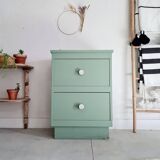 Old chest of drawers with two green drawers