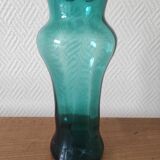 Blown glass vase with a flared neck and wavy rim.